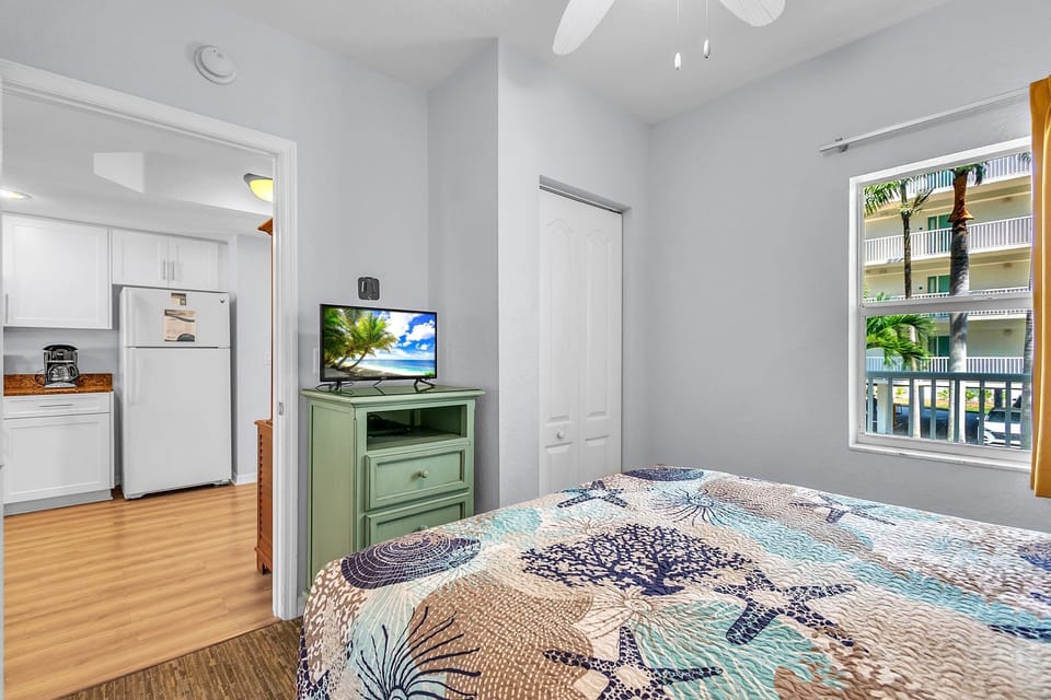 Guest Bedroom with Queen Bed and TV