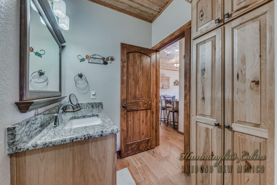 Second bathroom looking into kitchen