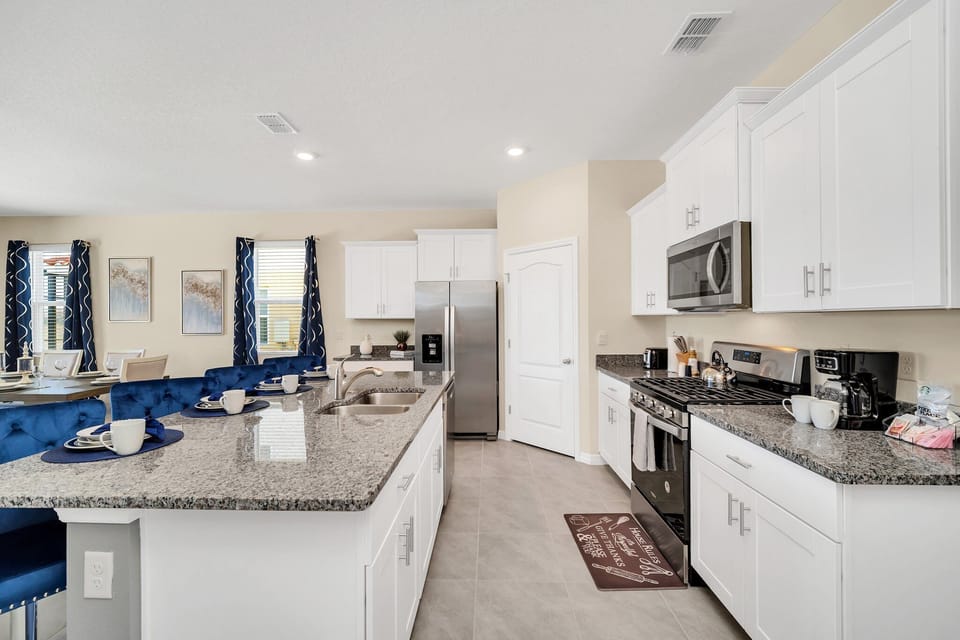 Open Elegance: Our townhouse kitchen is a visual delight, offering a spacious open concept that encourages a seamless flow between cooking and socializing