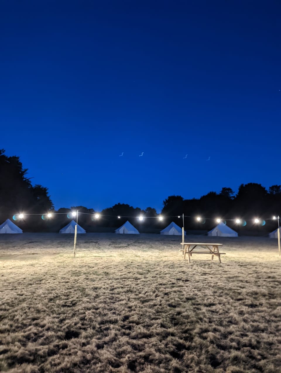 Bell Tents and Pavillion at night
