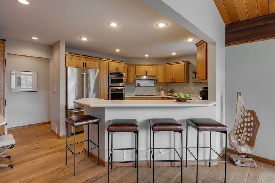 Chefs Kitchen with High End Appliances. Gather around the kitchen island. 