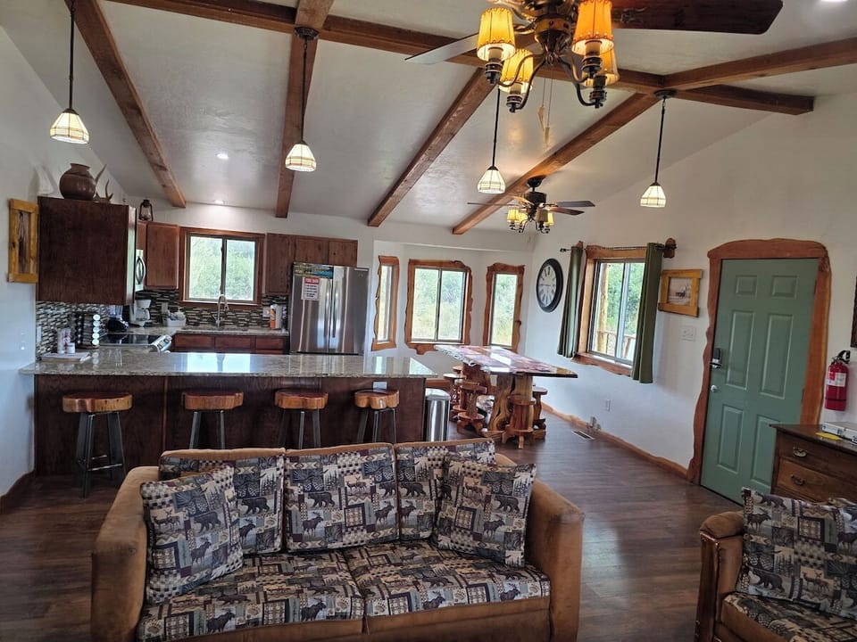 Wood-paneled fireplace with mounted Roku smart TV and a rustic live-edge mirror.