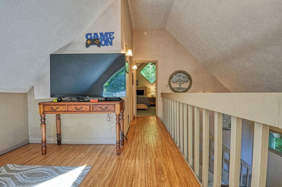 The loft area is connected to the upstairs bedroom and bathroom.