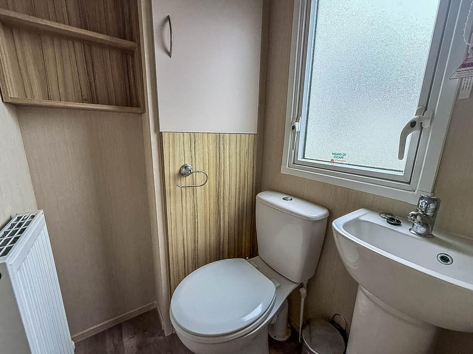 Cozy bathroom with natural light and warm wood accents