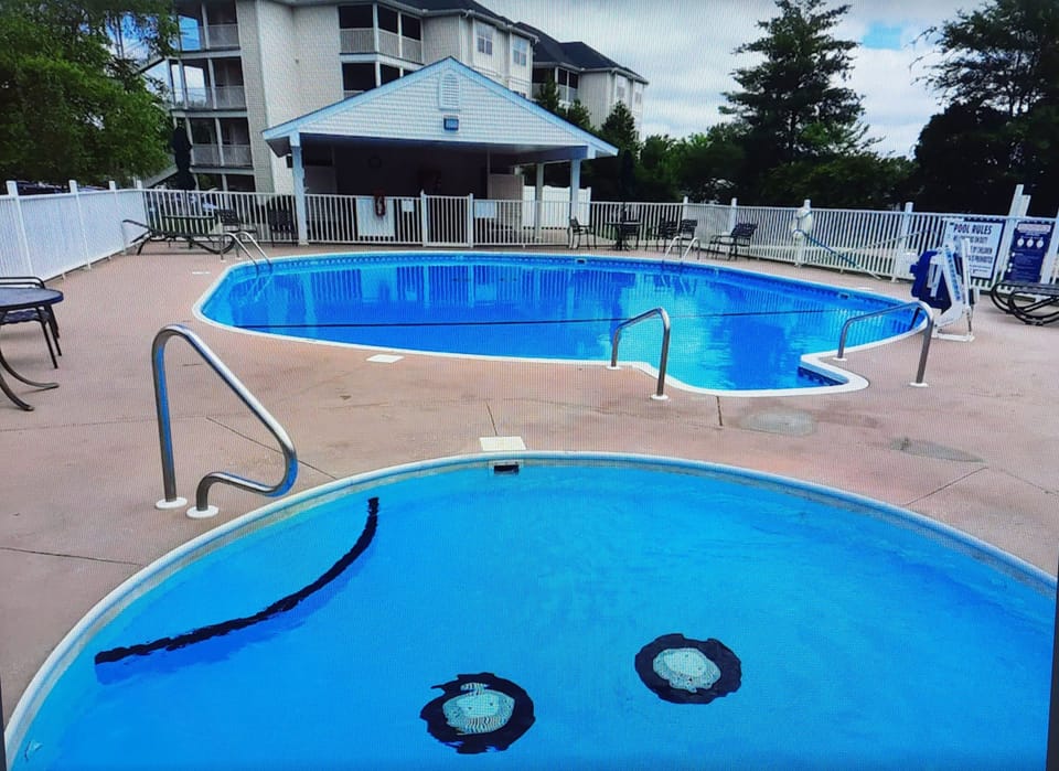 Large Outdoor Pool, Kids Pool, ample seating & covered patio!
