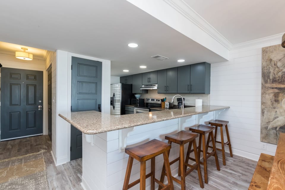 Large granite counter with bar seating for 4