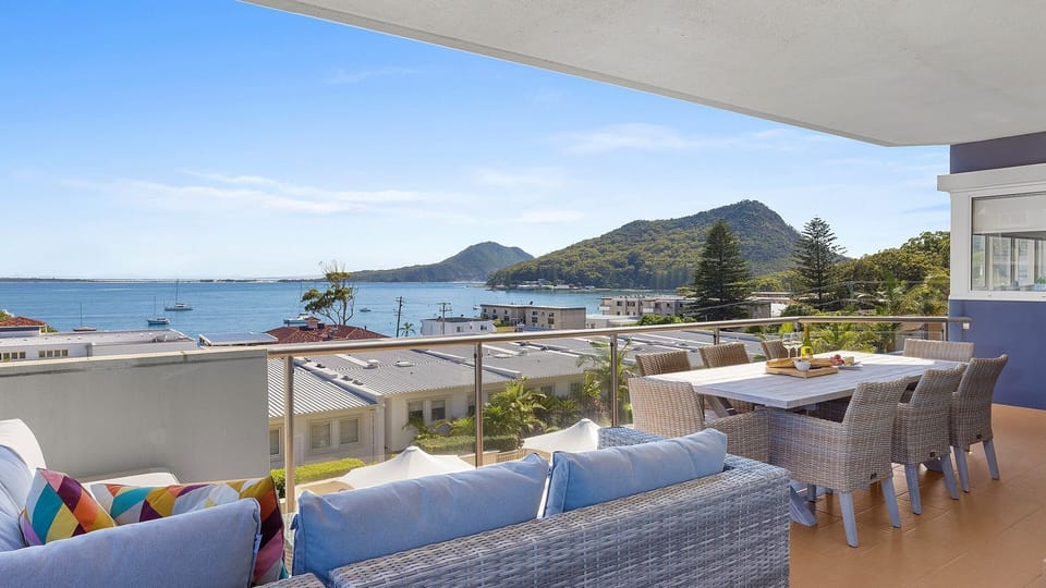 Heart and Shoal | Covered deck with water views | Dining and lounge
