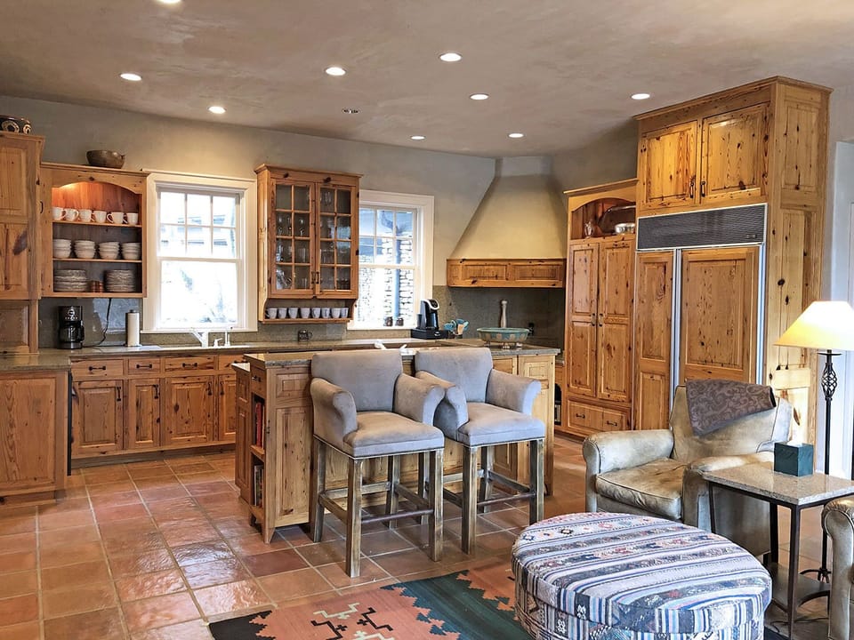 The Entry Foyer opens to Kitchen, Dining and Conversation Areas.  There is also a Half Bath off the Entry Foyer to serve the Main Level.