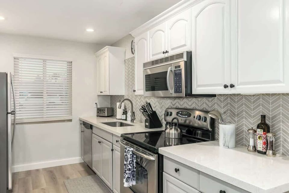 Fully stocked kitchen with stainless steel appliances
