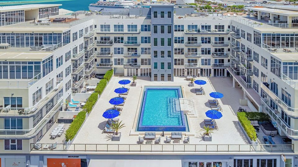 Stay energized with a fully equipped workout space featuring free weights, cardio equipment, and an inspiring ocean view to motivate your fitness routine.