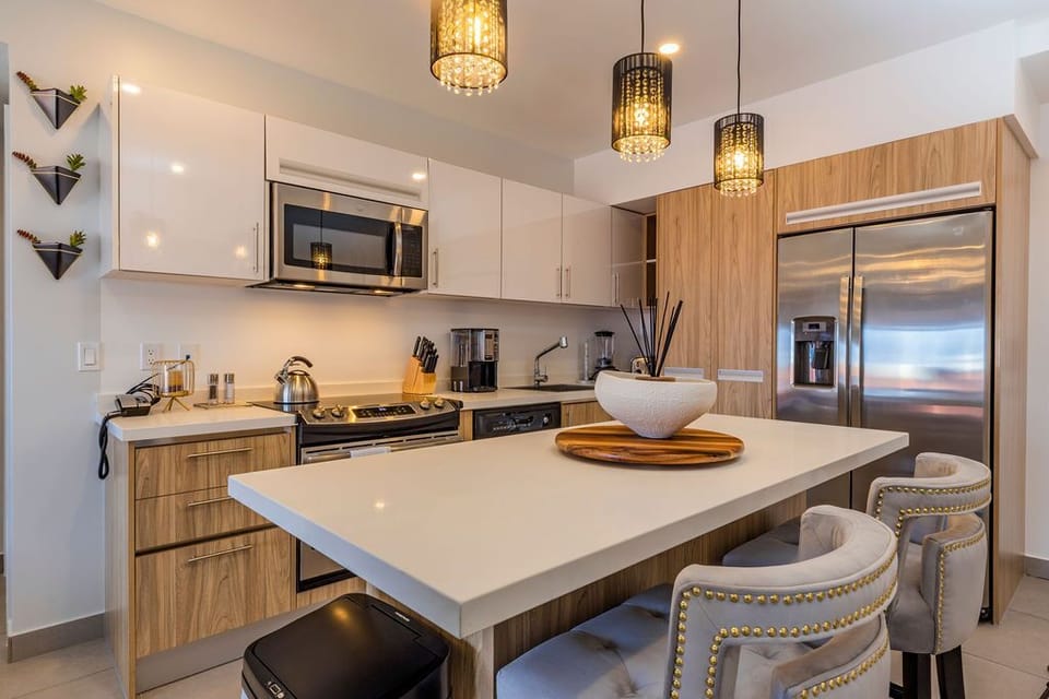 Modern entertainment setup with sleek TV, stylish console, and premium sound system—your perfect spot to unwind with movies or music after a day of exploring.