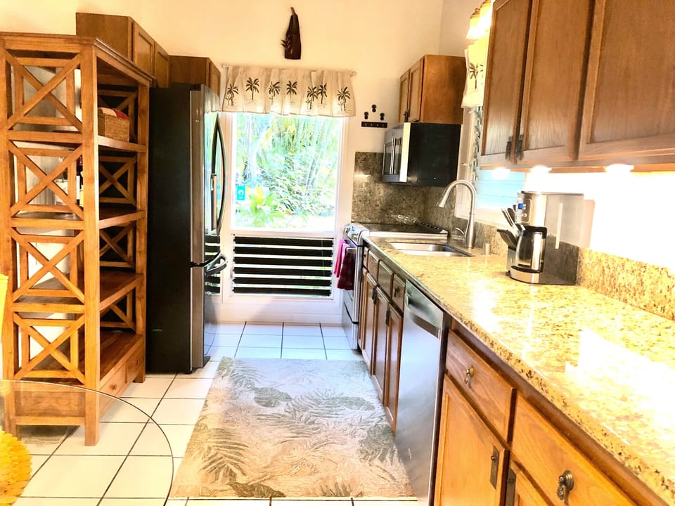 Kitchen with stove, oven, microwave, full size refrigerator, aBosch dishwasher