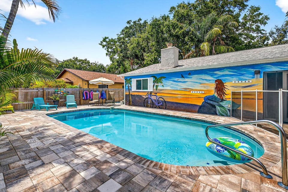 Beautiful private pool with floats & sun chairs. Equipped with a safety gate.