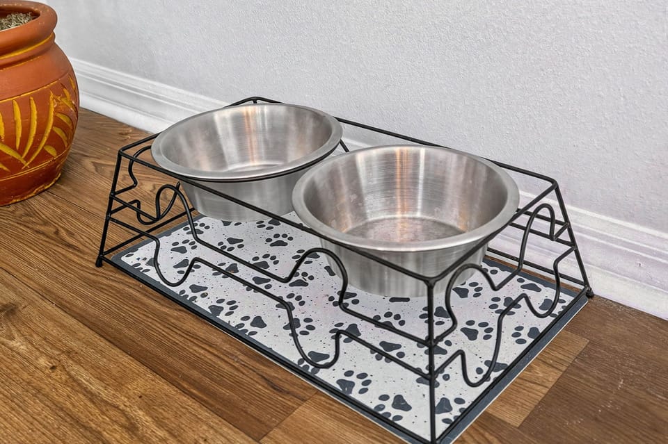 Kitchen-adjacent dining space includes a pet feeding station for your pets