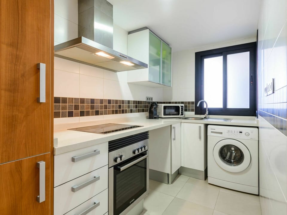 Cabinetry, Countertop, Property, Building, Furniture, Kitchen Stove, Kitchen Appliance, Kitchen, Home Appliance, Laundry Room