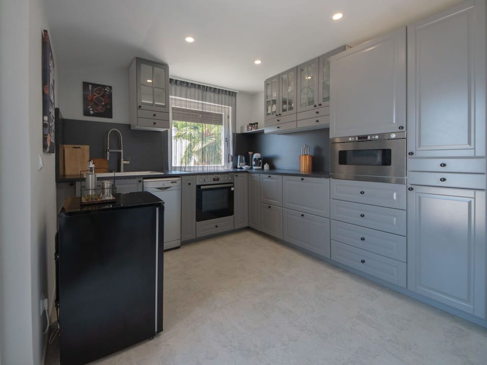 Countertop, Cabinetry, Furniture, Kitchen Appliance, Chair, Kitchen, Home Appliance, Kitchen Stove, Wood, Drawer