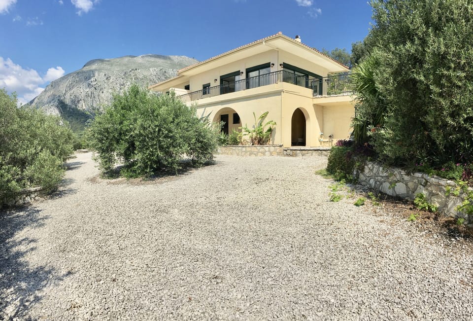 House with Mount Pantocrator in the background