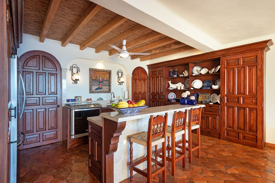Fully stocked, gourmet kitchen features indigenous, Parrota hardwood cabinetry!