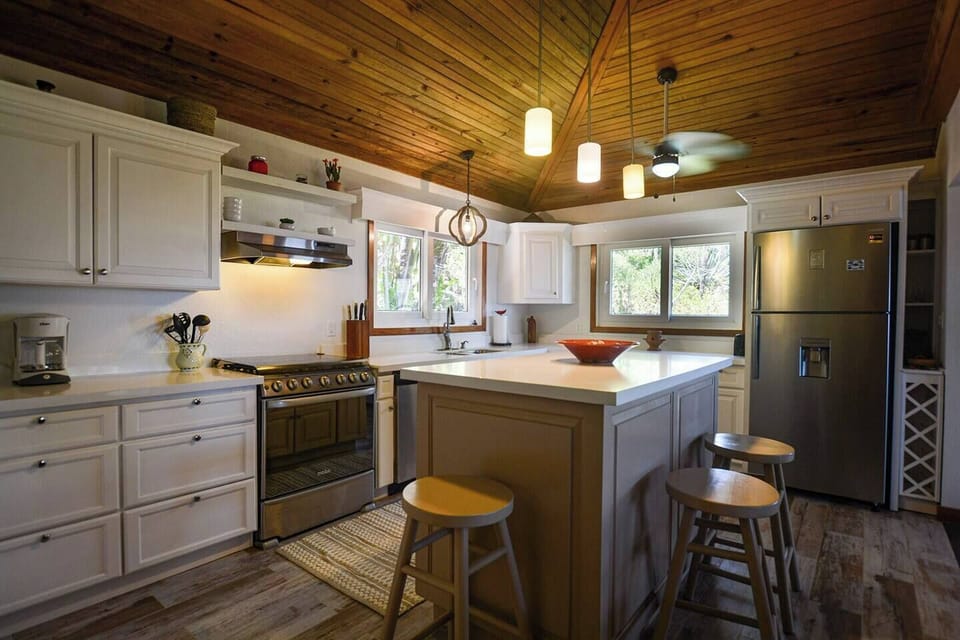 Kitchen with large island, dishwasher, range, microwave and all the extras