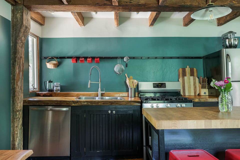 Fully equipped chef's kitchen with modern appliances.