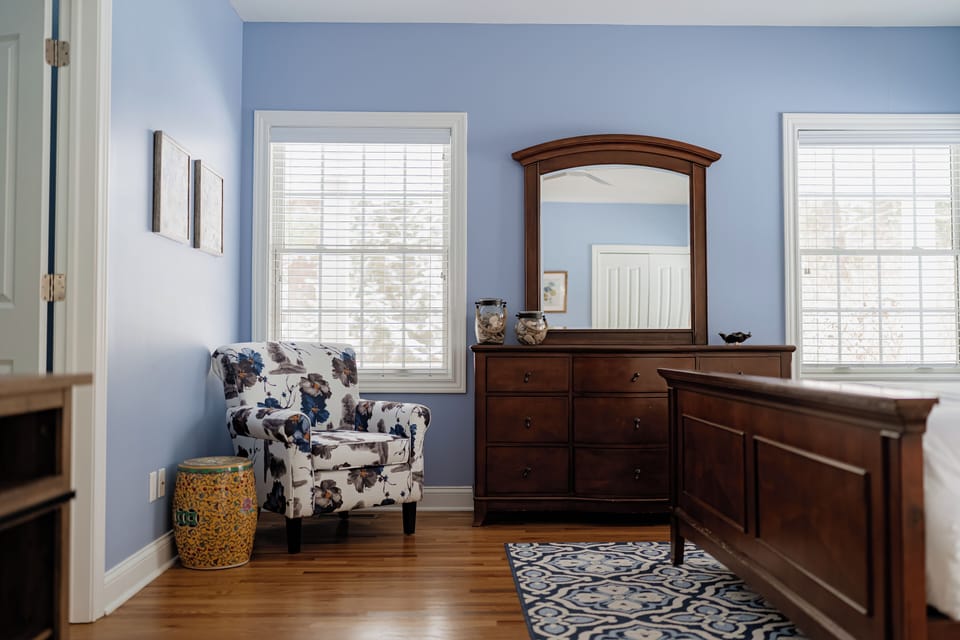 Main level primary bedroom with King bed and ensuite bathroom