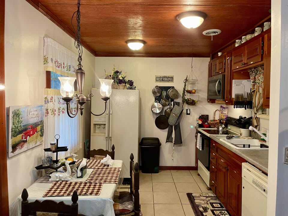 Kitchen fully stocked. Full sized appliances, pots and pans and cooking utensils