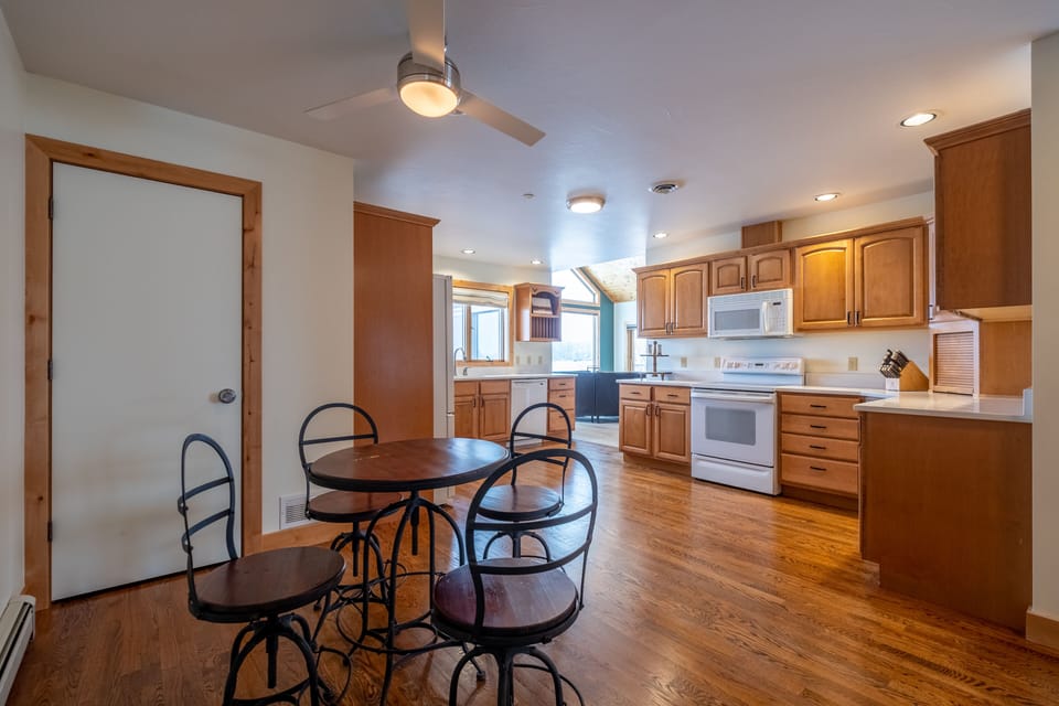 Enjoy cooking and serving meals in the fully equipped cozy kitchen