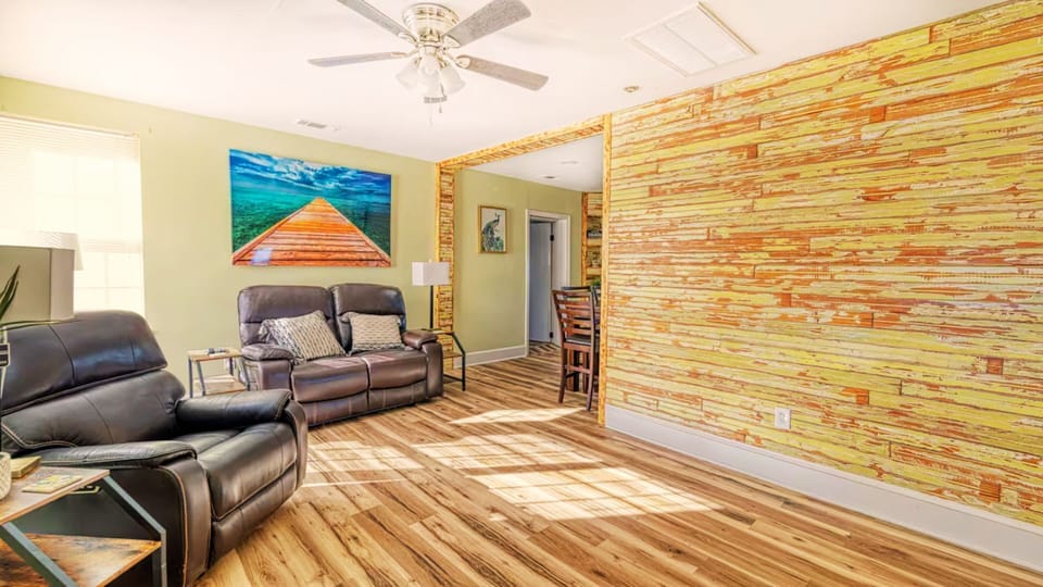As you enter, a 120-year-old bead board wall greets you, with a recliner set