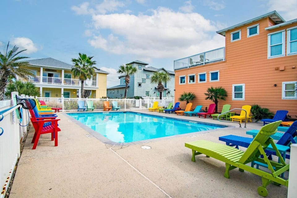 Sparkling community pool with plenty of lounge chairs for sunny afternoons.