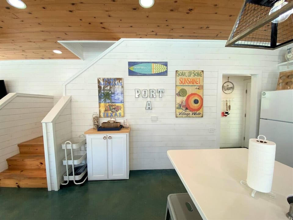 Coastal décor and open-concept layout — warm and inviting.