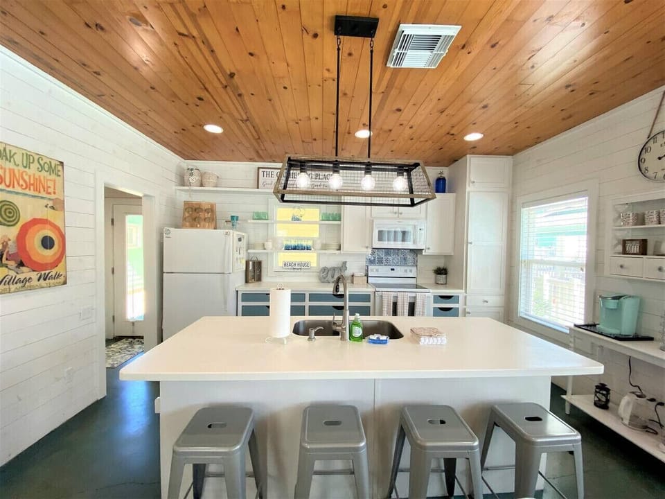 Large open kitchen with island seating and modern appliances.