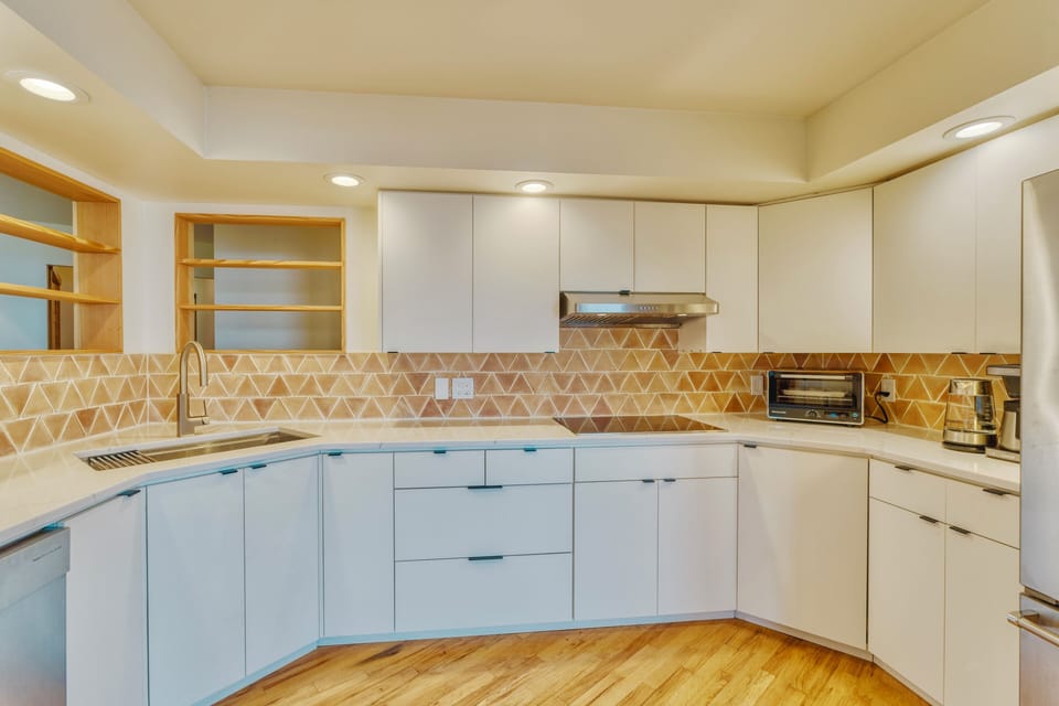 Newly remodeled kitchen with cooktop, fridge, toaster oven, kettle, coffee maker