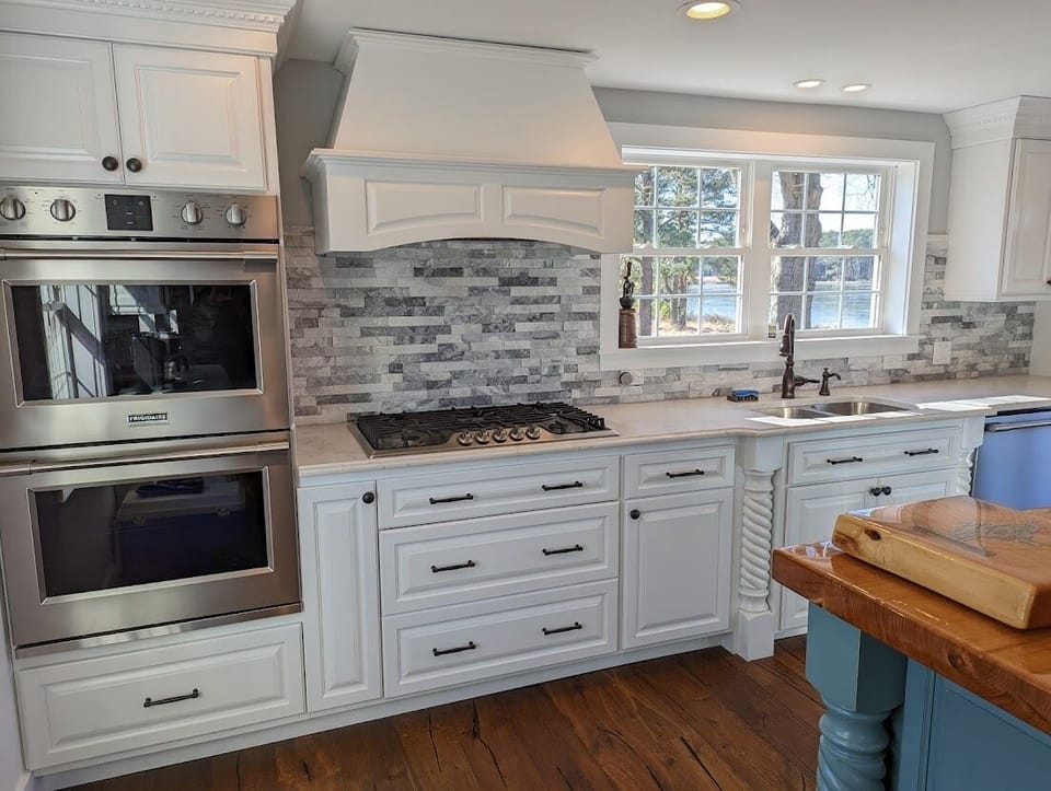 Kitchen has double oven, refrigerator, microwave, gas stove and dishwasher.