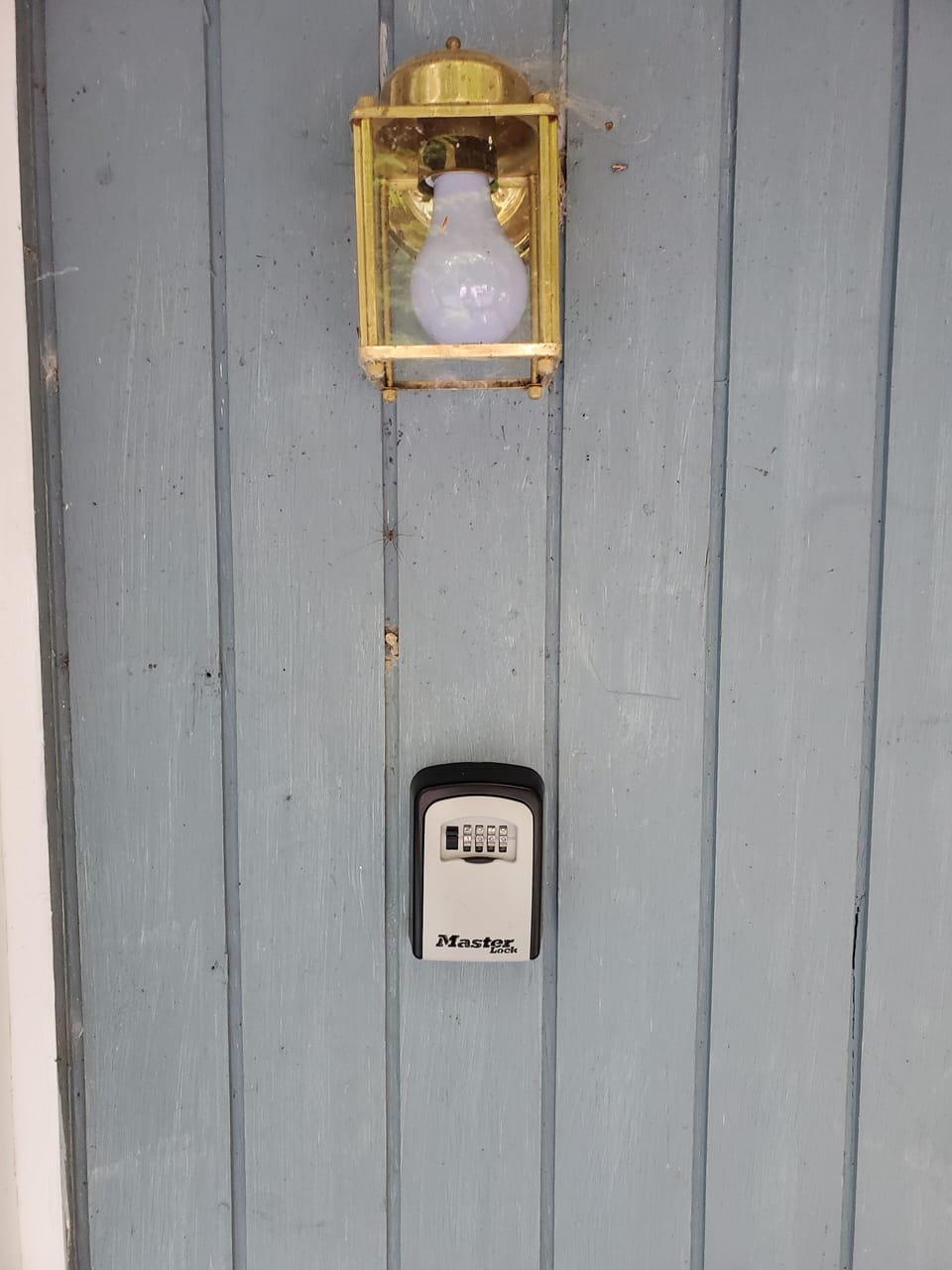Lockbox under porch light.