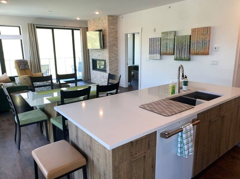 Kitchen island, dining table & family room.