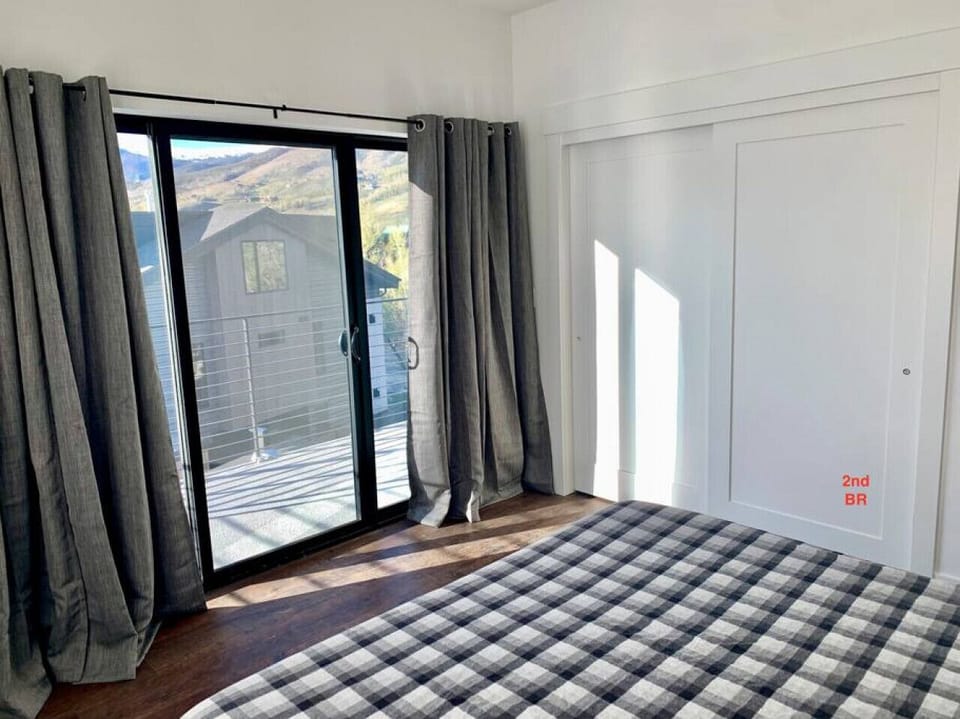 Second BR slider to balcony & wide closet.