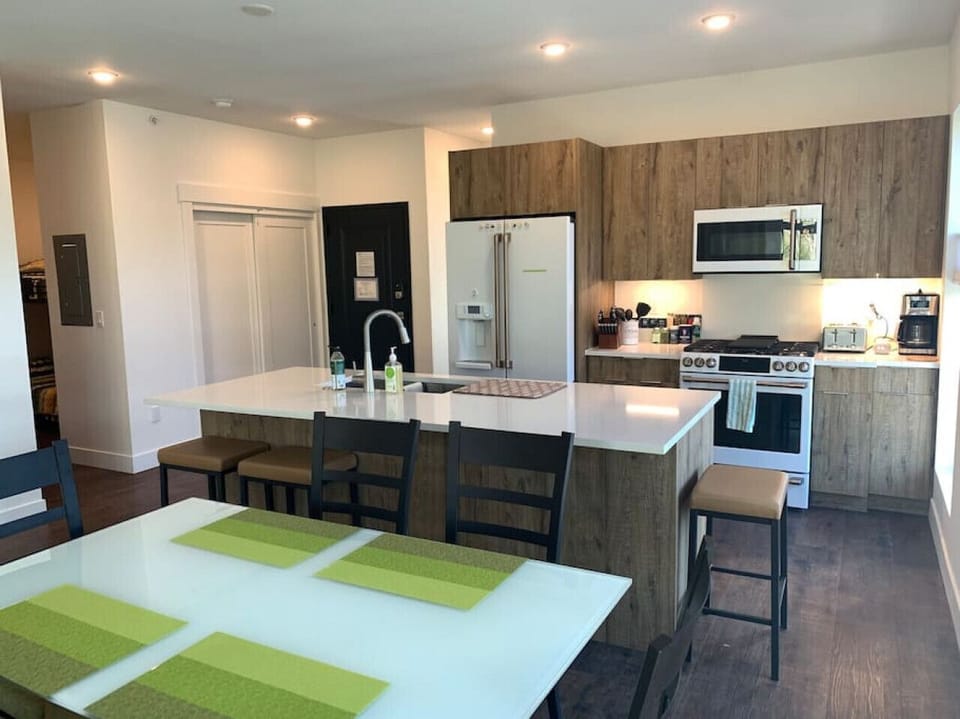 Dining table seats six. Three bar stools.