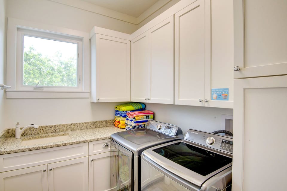 PRIVATE LAUNDRY ROOM INCLUDES IRON & IRONING BOARD, ALONG WITH BEACH TOWELS