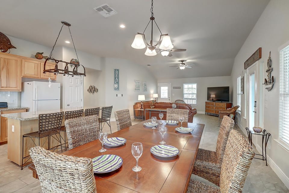 Dining and Additional bar seating - Share meals and laughter in the stylish dining area, enhanced by the coastal ambiance.