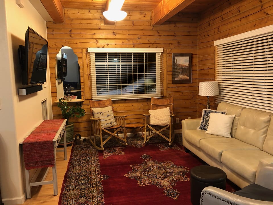 Living room with smart tv and surround sound.