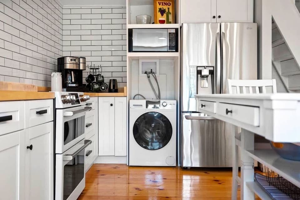 New washer/dryer all-in-one, new coffee maker with choice of brew pot or pods, microwave, fridge/freezer.