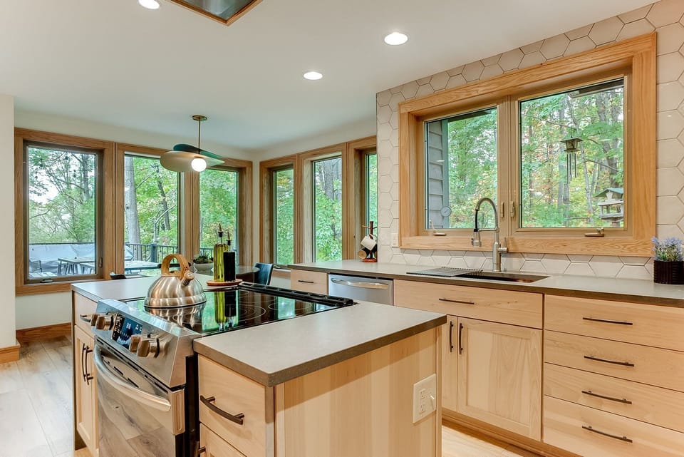 Newly remodeled kitchen with quartz countertops, Subzero fridge and eat-in area