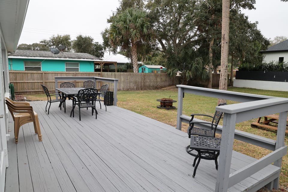 Large deck with table/chairs. Umbrella for shade, fire pit and picnic table 