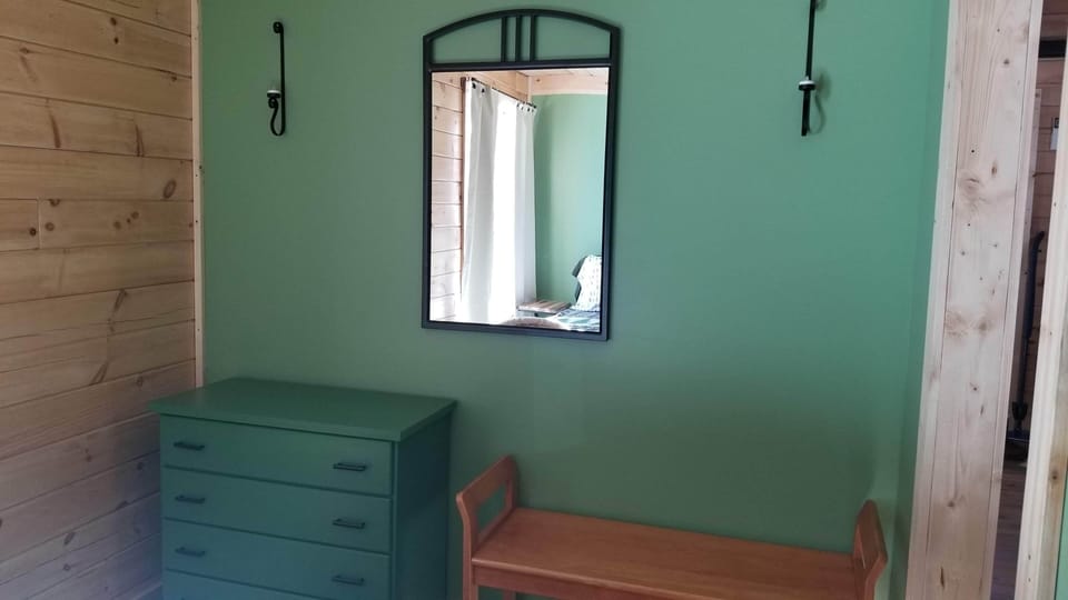 Dresser and bench in the queen bedroom