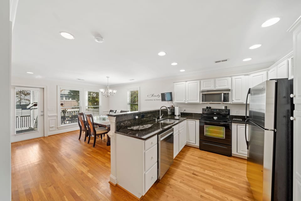 View of fully equipped kitchen and dining area