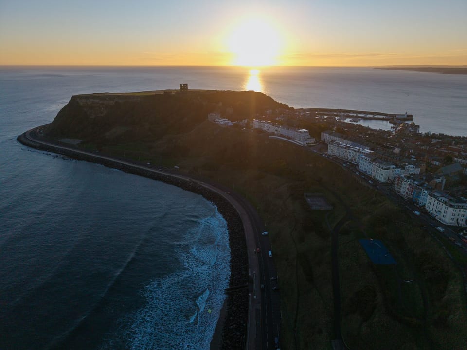 The Helaina overlooks Scarborough's beautiful North Bay, beach (high tide) and castle at sunrise. 