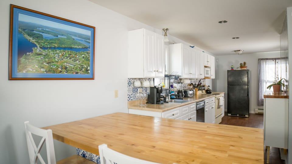 Kitchen island and reverse view of kitchen.