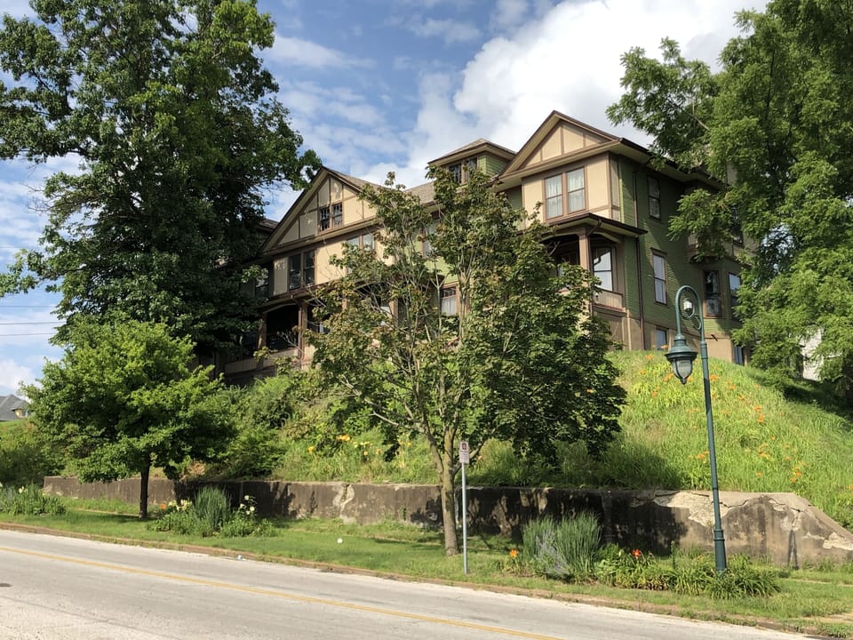 View of NW corner of W 7th and Gaines