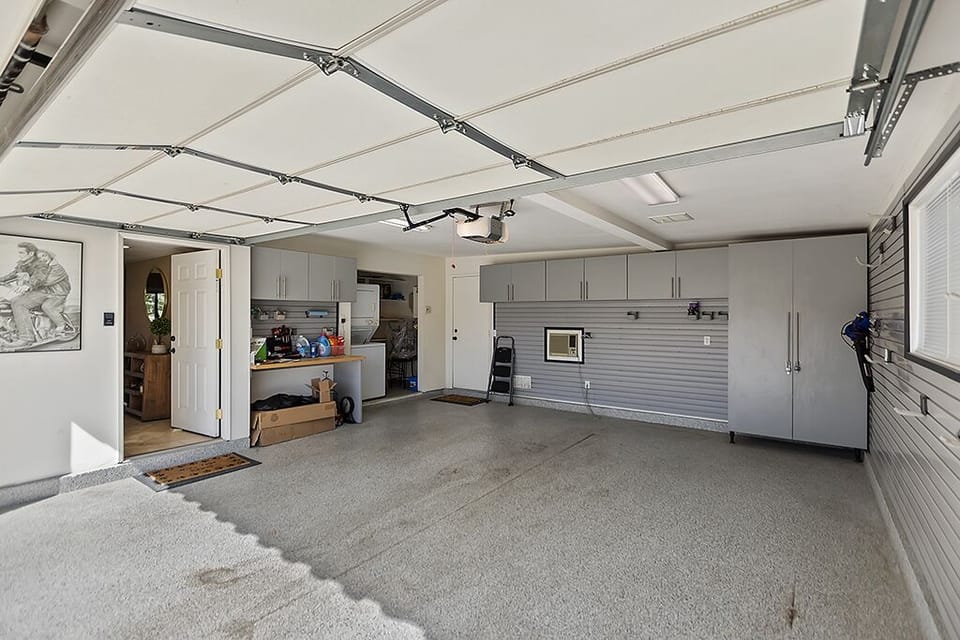 2 car garage with stacked washer and dryer 