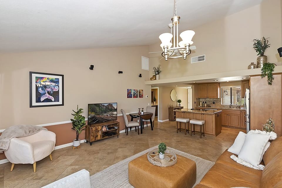 Spacious living room with plenty of seating and smart T.V. 